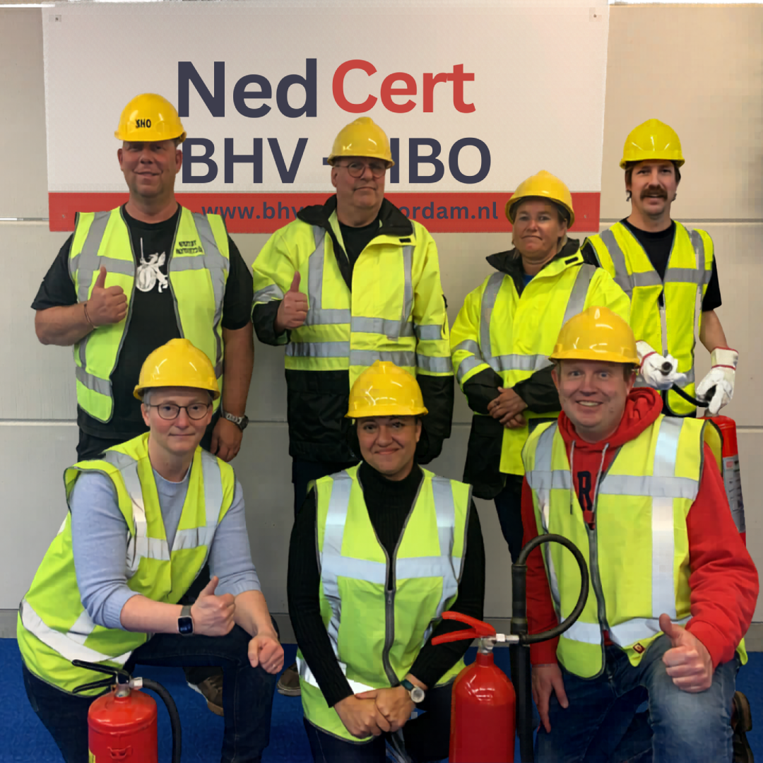 Team NedCert Experts: Pepijn Krikke (Amsterdam), René van der Helm (Leeuwarden), Bas van Steenbergen (Doetinchem & Belgium), Maureen Aardema (Emmen), Sylvia Kouijzer (The Hague), drs. Cleopatra Jessurun (Paramaribo) and Cor Houet (corporate instructor) wearing safety vests with fire extinguishers, ready for BHV and ERO training sessions.